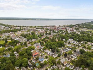 Outdoor - A stunning aerial view of Geneva, NY, showcasing the beautiful Seneca Lake and the charming neighborhood, perfect for those seeking a serene and picturesque setting.