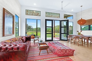 Open concept living area in the Plum Wild unit, on the right side of the property