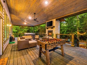 PATIO: Enjoy game night with foosball, outdoor dining, a fire, and nature all around!