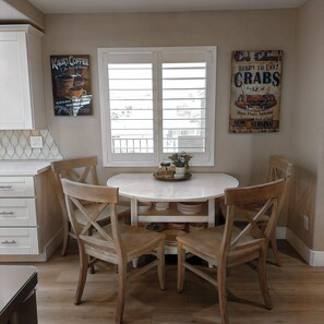 Seating at dinette and counter-top.  Dining table with leaves in Bonus Suite.