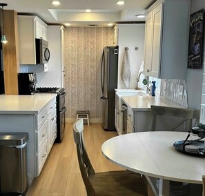 Kitchen- Double oven, convection microwave, gas cooktop, dishwasher, fridg.