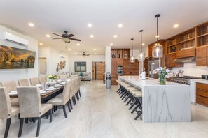 Main House - The dining room table can easily acccomodate the group.