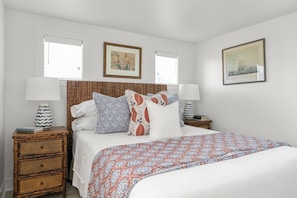 Enjoy a restful sleep on a queen-sized bed with premium linens.