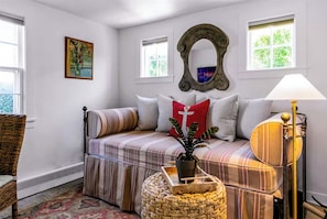 Enjoy this bright bedroom with a queen sleeper sofa.