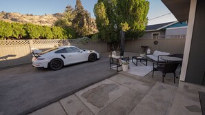 Private gated parking and patio area.