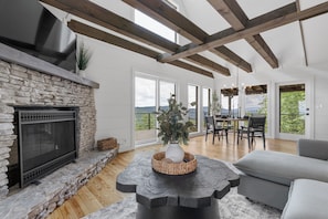 Main level Living room w/ wood burning fireplace