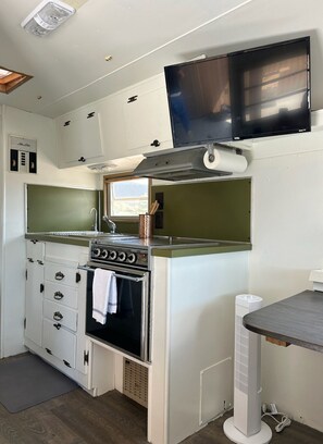 Charming and functional kitchen space.