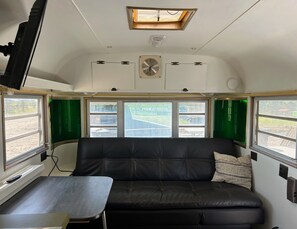A comfortable leather sofa which doubles as a bed.