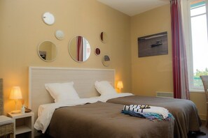 Drift to sleep in the comfortable bed after a wonderful day outside. Bedding configurations vary.