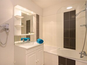 Get ready for your day in the lovely bathroom.
