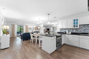 Open concept kitchen/dining/living