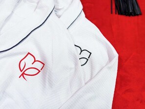 Enhance your comfort during your stay with our beautiful, plush bathrobes, provided exclusively for our guests. Each robe is crafted from premium, soft materials to wrap you in warmth and luxury. Adorned with our elegant custom logo, these robes add a touch of sophistication to your experience, making your time with us even more special. Whether you’re lounging in your room or ...