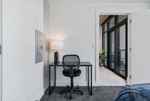 Dedicated Work Space with desk, chair and lamp.