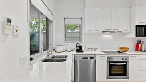 Welcome to our pristine kitchen, where cleanliness meets functionality. Every surface gleams with freshness, inviting you to create culinary masterpieces in a space that's as immaculate as it is efficient. From sleek countertops to gleaming appliances, ou