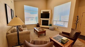 Comfortable Living Room with Smart TV & Fireplace