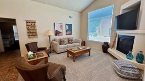 Comfortable Living Room with Smart TV & Fireplace