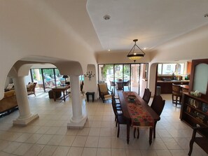 Interior dining area, patio dining, and office area