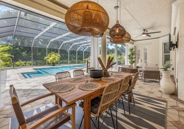 Enjoy lunch or dinner at the  beautiful patio dining table.