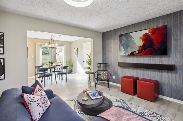 Enjoy the open-concept living room that flows seamlessly into the dining area—perfect for gathering, lounging, and making memories together.