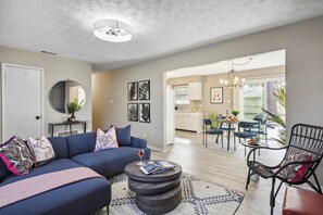 Relax in the spacious living room that opens effortlessly to the dining area and kitchen—creating the perfect space for connection and comfort.