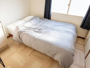 ・[Guest room example] Equipped with one double bed. Can accommodate up to two people.