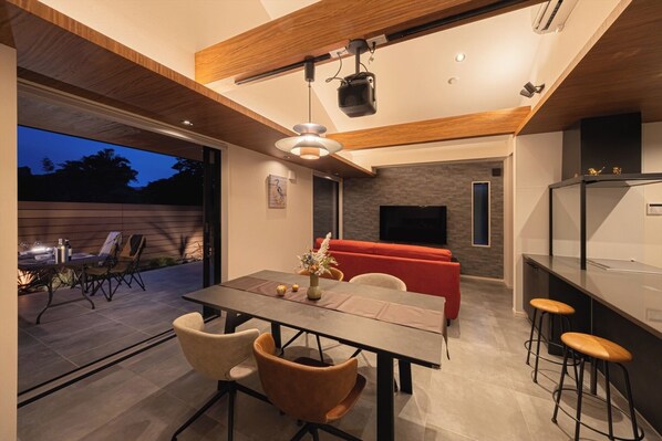 The windows open fully, making it easy to move between the living room and the dining area.