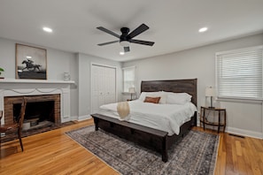 Relax in our spacious primary bedroom with a plush king-sized bed.