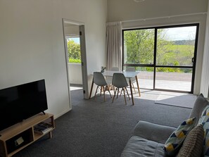 Dining table in lounge with hill view