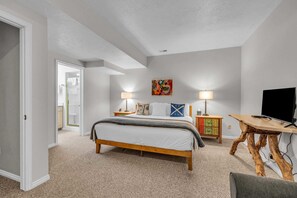 Bedroom 1: King bed, Smart TV with basic cable, en-suite bath, lower floor