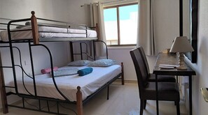 Bedroom with 1 Queen bed and on top one twin bed