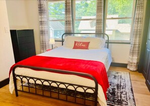 This simple bedroom is a peaceful retreat, designed for comfort and relaxation. With a cozy bed, soft linens, and a serene atmosphere, it’s the perfect space to unwind and recharge after a busy day. Simple, yet inviting, it offers everything you need for 