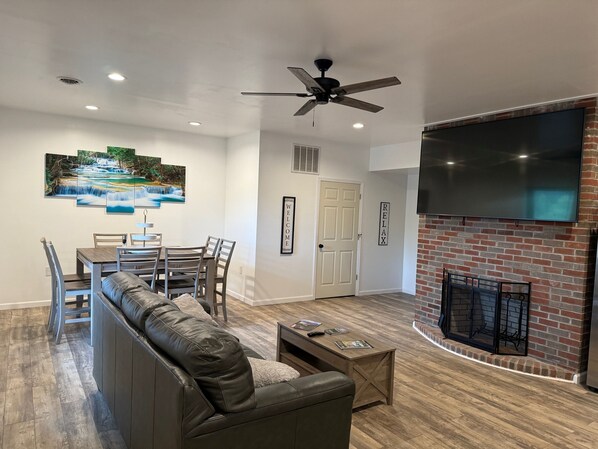 Custom Floor to Ceiling fireplace with 86" wall mounted Smart TV.