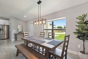Dining area with 4 chairs and a bench