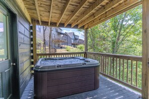 Enjoy the hot tub on the lower deck, along with outdoor dining table.