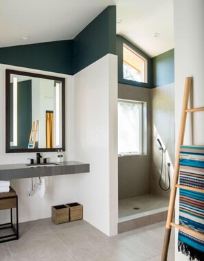 Refresh and rejuvenate in this modern bathroom, complete with sleek fixtures and plenty of natural light.