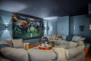 Our theatre room is the perfect place to hang out with tons of comfy seating