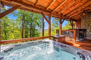 Enjoy stunning Smoky Mountain views from the hot tub.