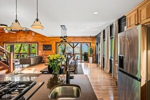 Prepare meals and dine with incredible views in this spacious open concept space