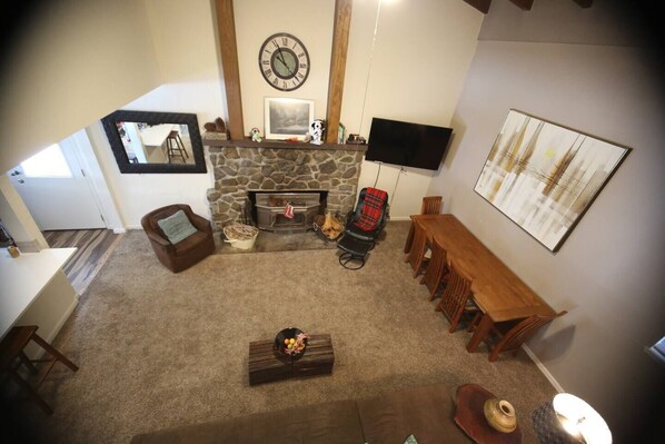 The large living room hosts great family dinners with a beautiful table