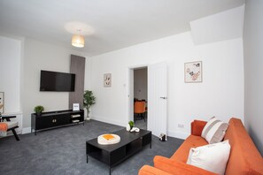 The room features pristine white painted walls that provide a bright and airy atmosphere.