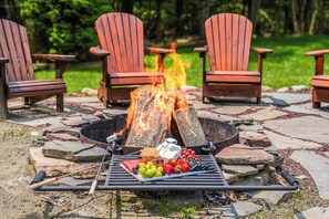 Whether you're roasting s’mores, sharing stories around the fire, or sipping drinks by the lake, this waterfront fire pit area offers the perfect blend of warmth, comfort, and unforgettable views.