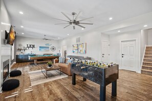 Lower Level Game room with foosball, pool table and bunk area.