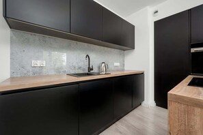 Kitchenette with an oven.
