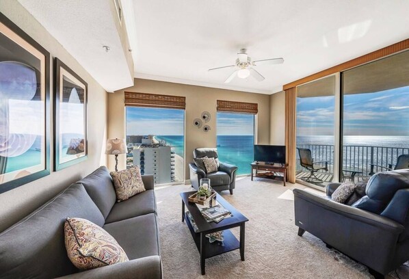Living room with queen sleeper sofa and balcony access