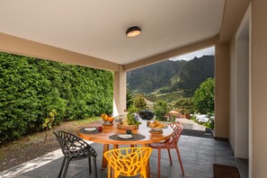 The Covered Outdoor Dining Area Of Casa Hortencia By Ourmadeira With The Beautiful Contryside Views Of The Sao Vicente Mountains