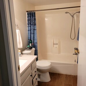 second bathroom  has bath shower  combo 