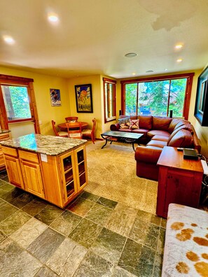 The kitchen island is a great workspace for food prep or serving food.