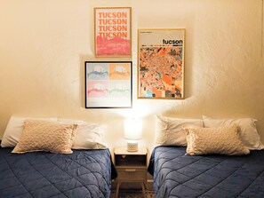 Spacious bedroom with two queen beds.