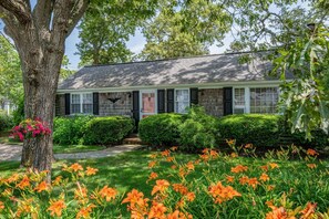 Beautiful front yard with lots of shade and blooming native flowers