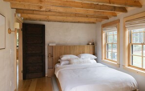 The main floor bedroom with queen Casper mattress, Article bed frame, organic linens, and room darkening shades.
